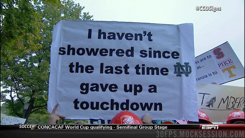 Illustration for article titled Eifert Tower! Your Roundup Of The Best Signs Behind The College Gameday Crew, Plus Lee Corso Dressed As A Leprechaun